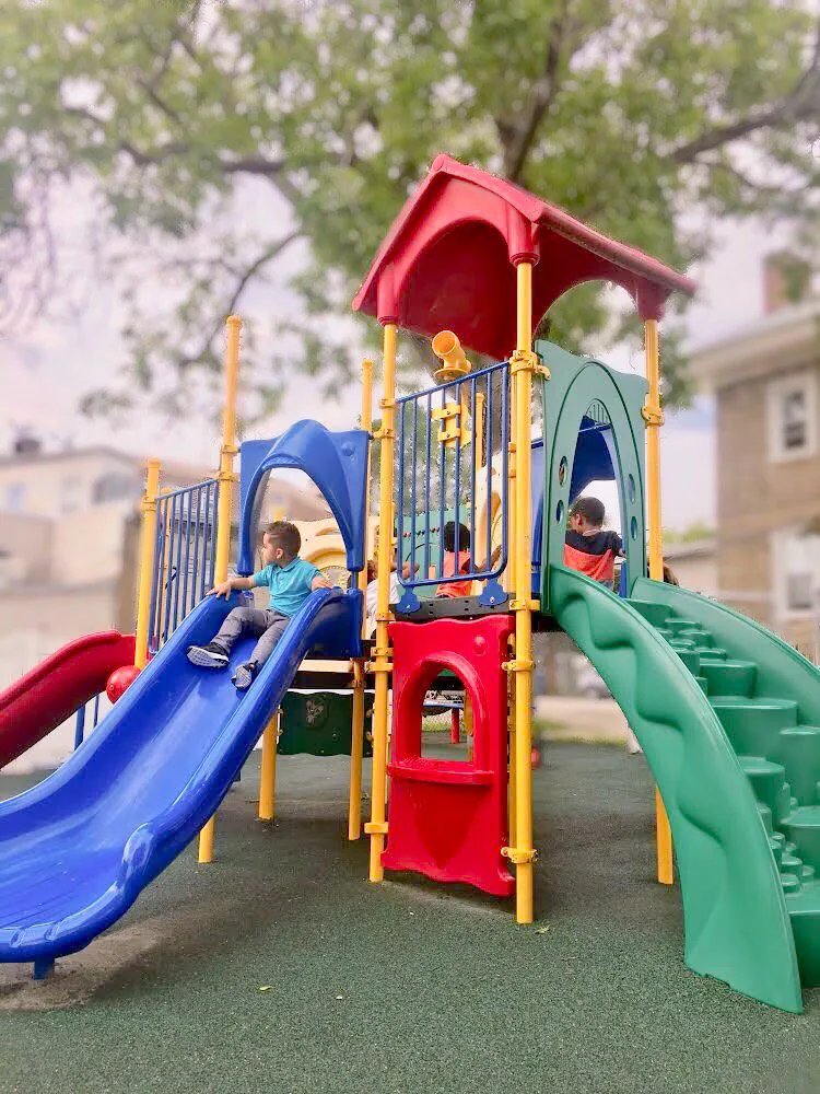 Children playing on slides at Rising Sun Children's Center.