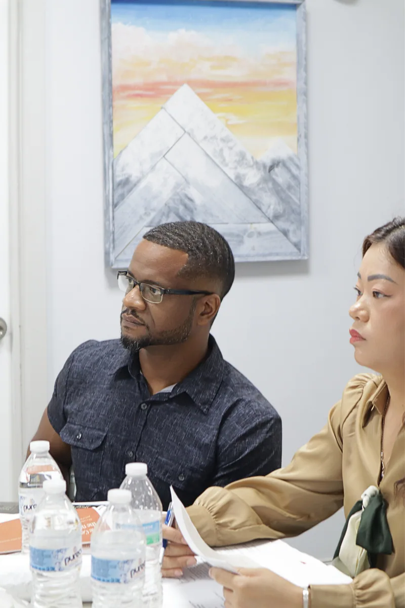 SoHi Center staff members listening during a board meeting.